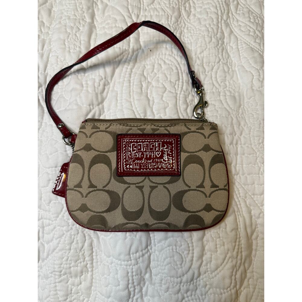 Coach authentic Poppy signature Gold Red wristlet gently loved